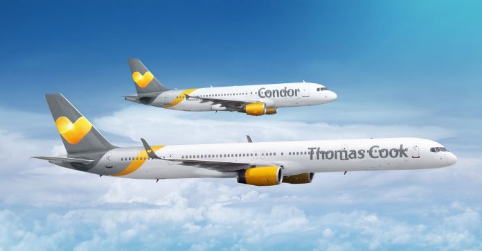 Zwei Flugzeuge on gelb-grauer Farbe in der Luft. Eines ist groß mit "Thomas Cook" und ein Flugzeug mit "Condor" beschrieben. 